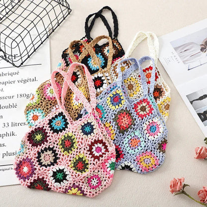 Multicolor crochet tote with floral granny-square pattern and top braided handles