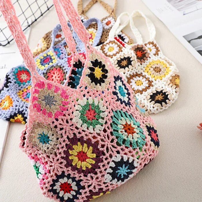 Pink multicolor crochet tote with floral granny-square motifs and openwork panels
