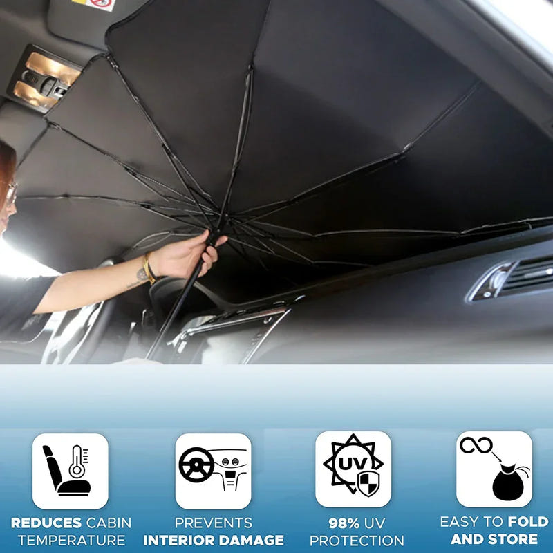 Open black car sun umbrella shade fitted under windshield, held by hand