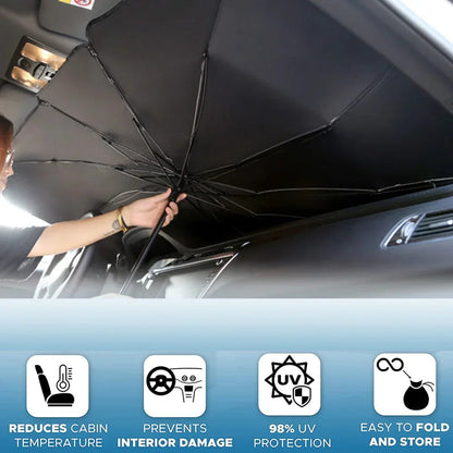 Open black car sun umbrella shade fitted under windshield, held by hand