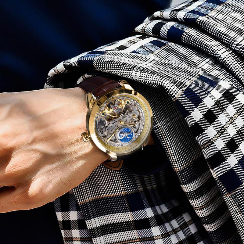 Mechanical skeleton watch with gold case and brown leather strap, blue moon phase dial