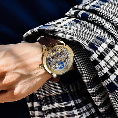 Mechanical skeleton watch with gold case and brown leather strap, blue moon phase dial