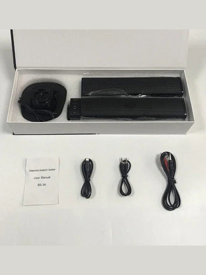 Bluetooth speaker kit in box with black soundbars, manual, and USB cables