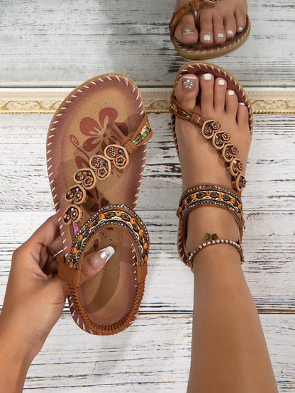 Women’s ethnic beaded sandals in brown with rhinestone bands and bead medallion details.