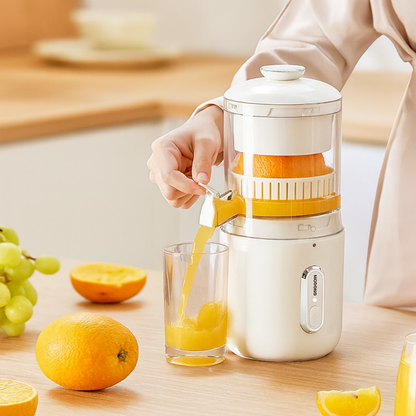 Person using a manual juicer to extract juice from oranges on a kitchen counter.