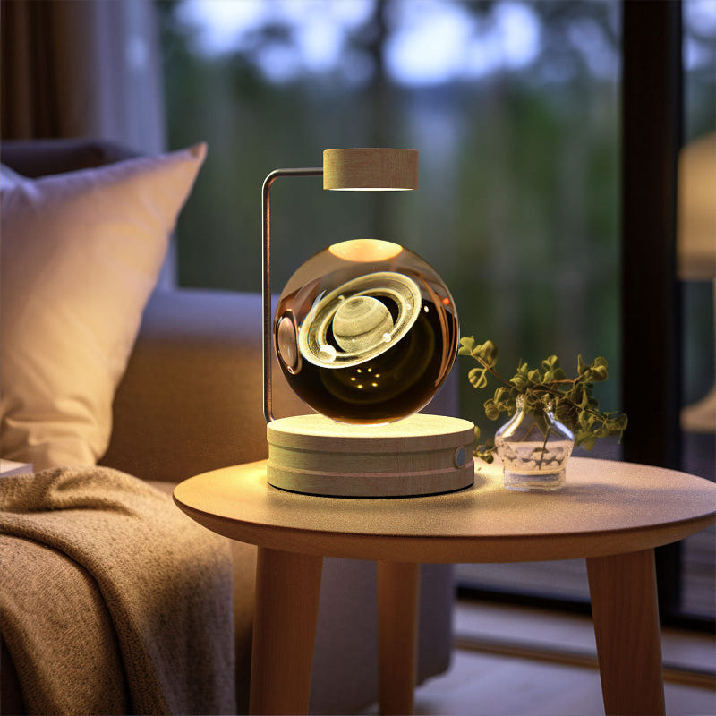 Crystal ball LED night light showing bright swirl glow in clear glass dome on wood base