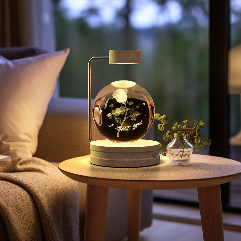 Crystal ball LED night light with warm glowing design inside clear glass dome and wood base