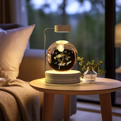 Crystal ball LED night light with warm glowing design inside clear glass dome and wood base