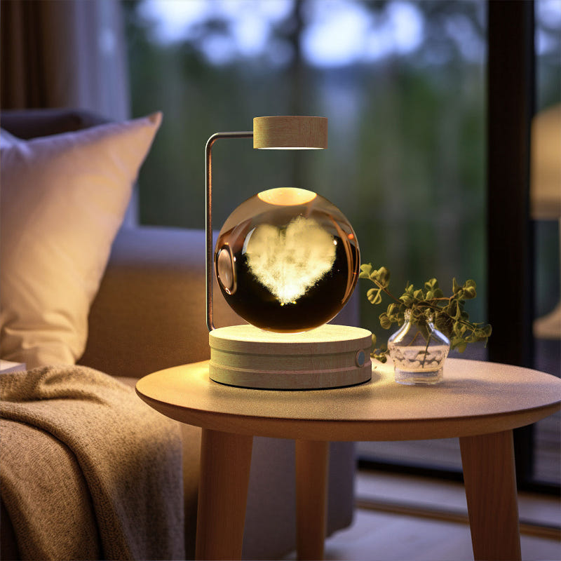 Crystal ball LED night light with glowing globe inside clear glass dome and wood base