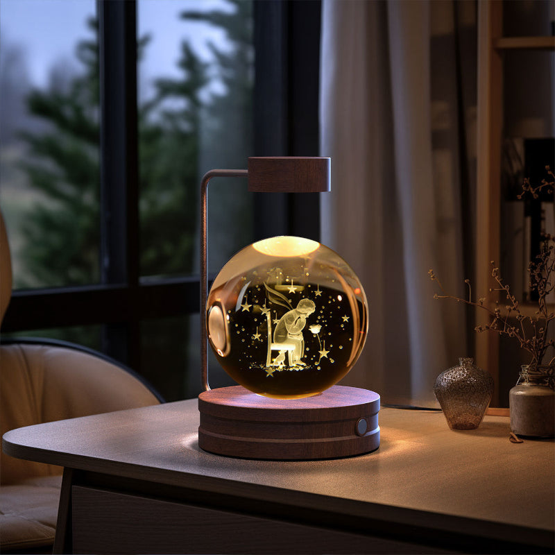 Decorative lamp with a glass sphere on a wooden table