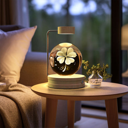 Cosmic LED night light with glowing four-leaf clover design in crystal dome