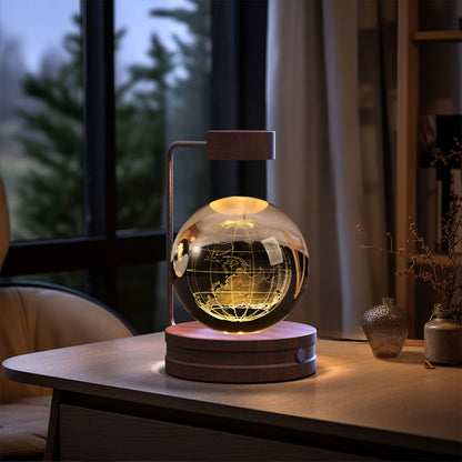 Glowing globe lamp on a table with a blurred background