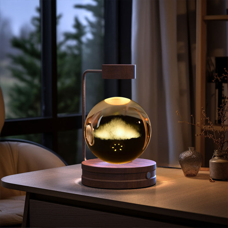 Decorative lamp with cloud effect on a table in a room with a window and plants.