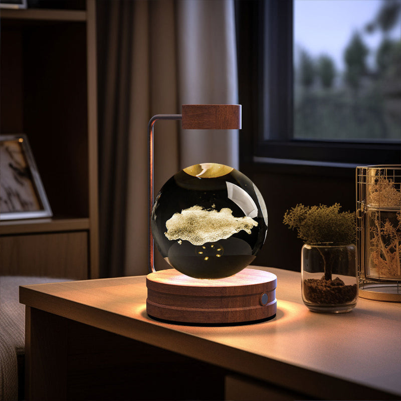 Crystal ball cosmic LED night light with aurora-like glowing pattern in dark glass sphere