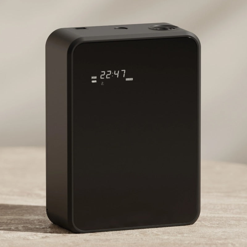 Black electronic device with digital display on a neutral background