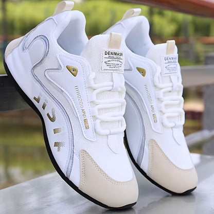 White and beige sneakers with brand labels on a blurred natural background
