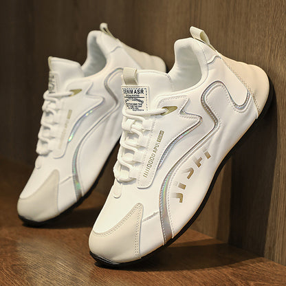 White sneakers with brand logo on a wooden surface
