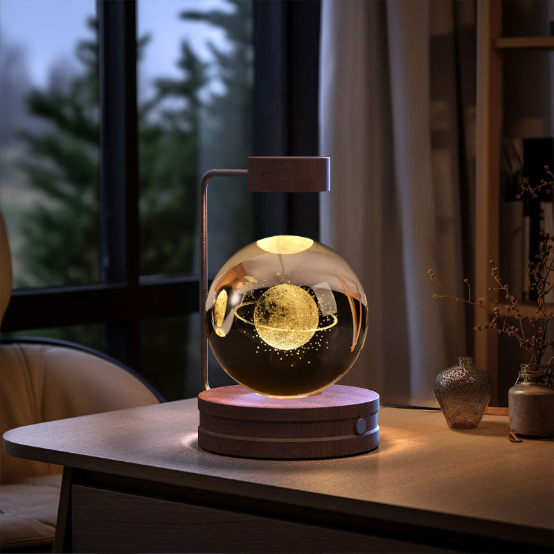 Decorative lamp with glass sphere on a wooden base in a room setting
