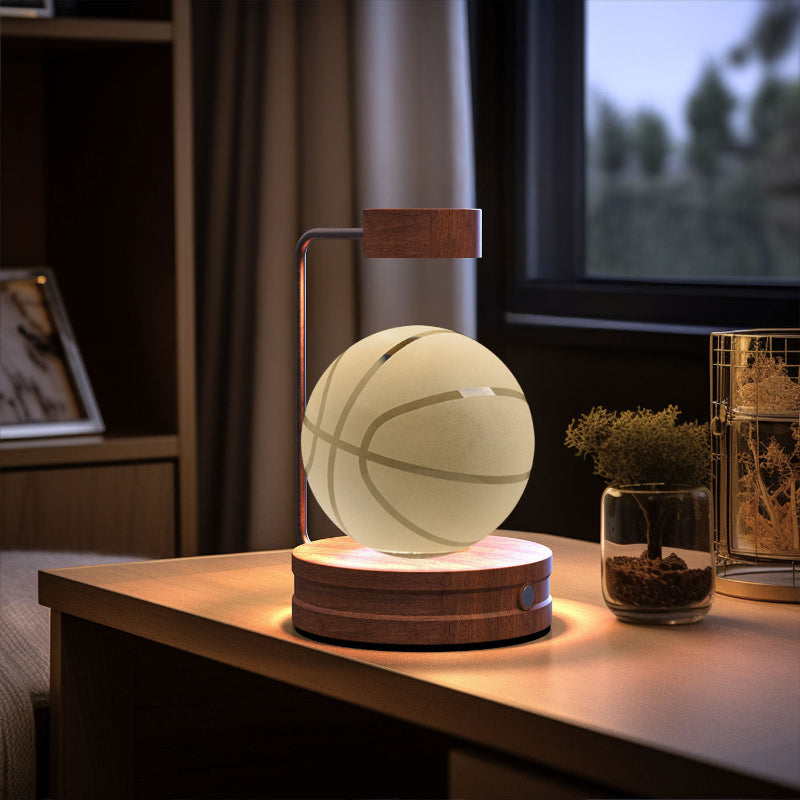Crystal ball cosmic LED night light with glowing pale sphere on round wooden base