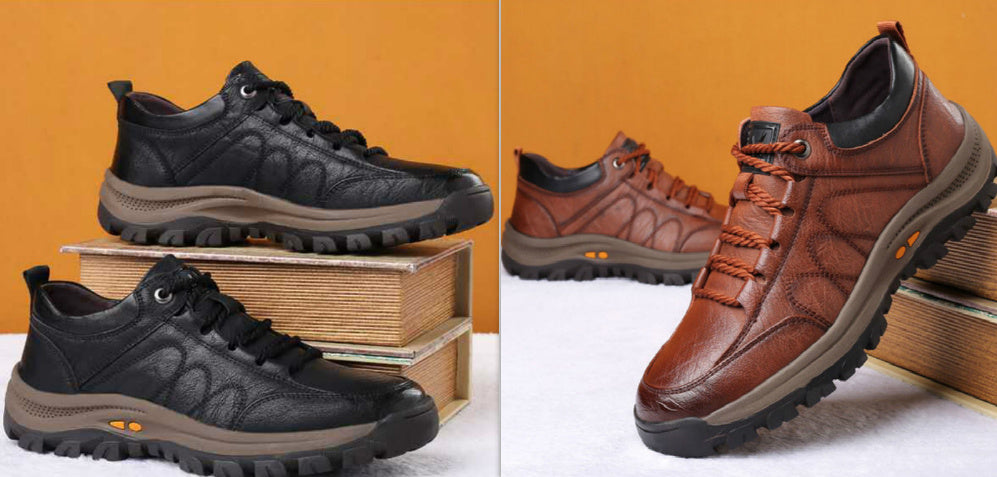Pair of black and brown leather shoes on a white and orange background