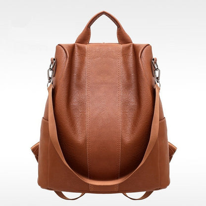 Brown leather backpack on a white background