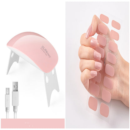 Pink foot care device with USB cable and foot patches on a white background