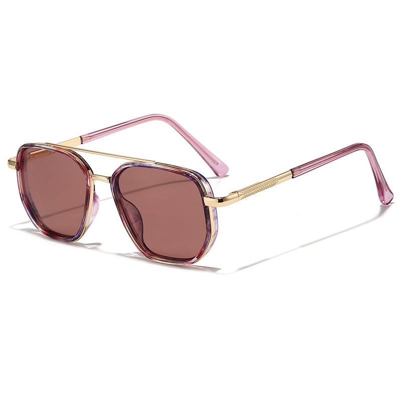 Pink translucent metal sunglasses with brown tinted lenses and gold hinge accents