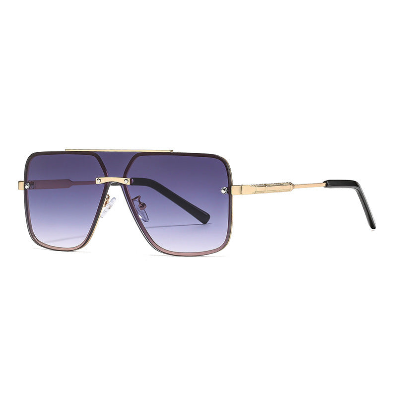 Sunglasses with gold frame and gradient lenses on a white background