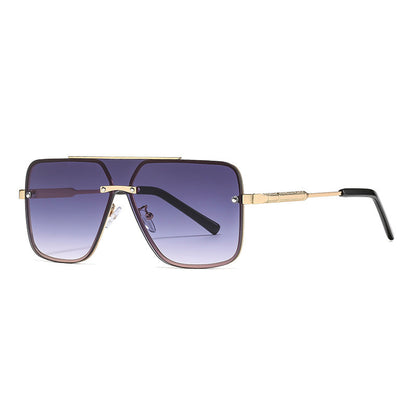 Sunglasses with gold frame and gradient lenses on a white background