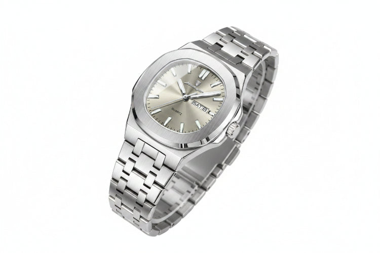 Silver watch with a metal bracelet on a beige surface, featuring a certificate of conformity.