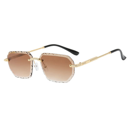 Sunglasses with gold frame and brown gradient lenses on a white background