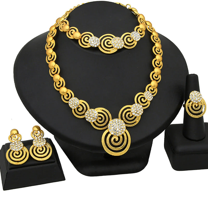 Gold-tone rhinestone necklace with matching swirl drop earrings