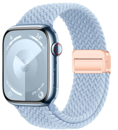 Smartwatch with a light blue woven band and rose gold buckle on a white background