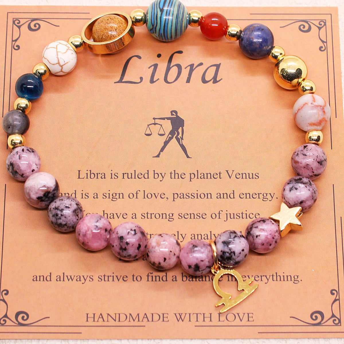 Libra zodiac stone bracelet with pink and purple beads, gold tone accents, star charm