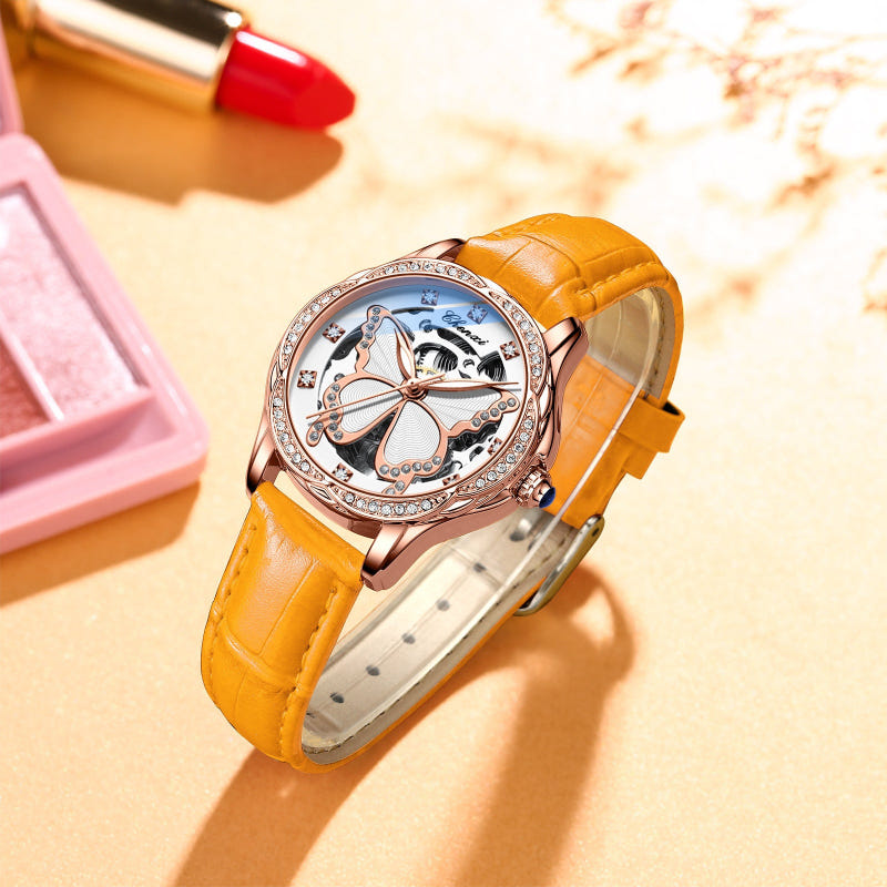 Orange leather strap round automatic watch with jeweled bezel and butterfly skeleton dial