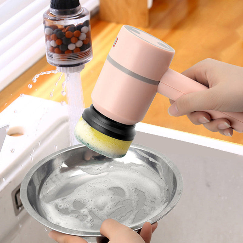 Person using a dishwashing brush with a sponge on a metal plate under running water.