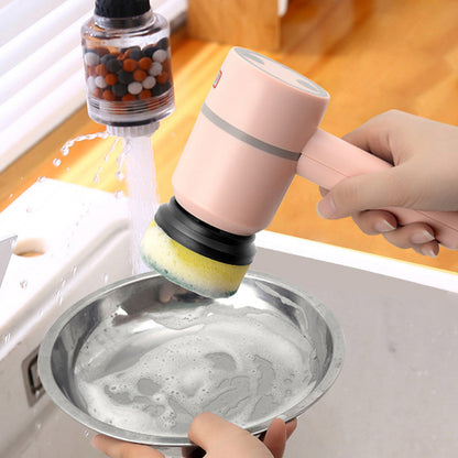 Person using a dishwashing brush with a sponge on a metal plate under running water.
