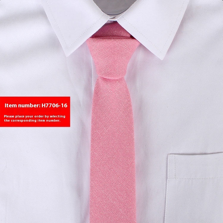 Pink tie worn with a white shirt on a light gray background