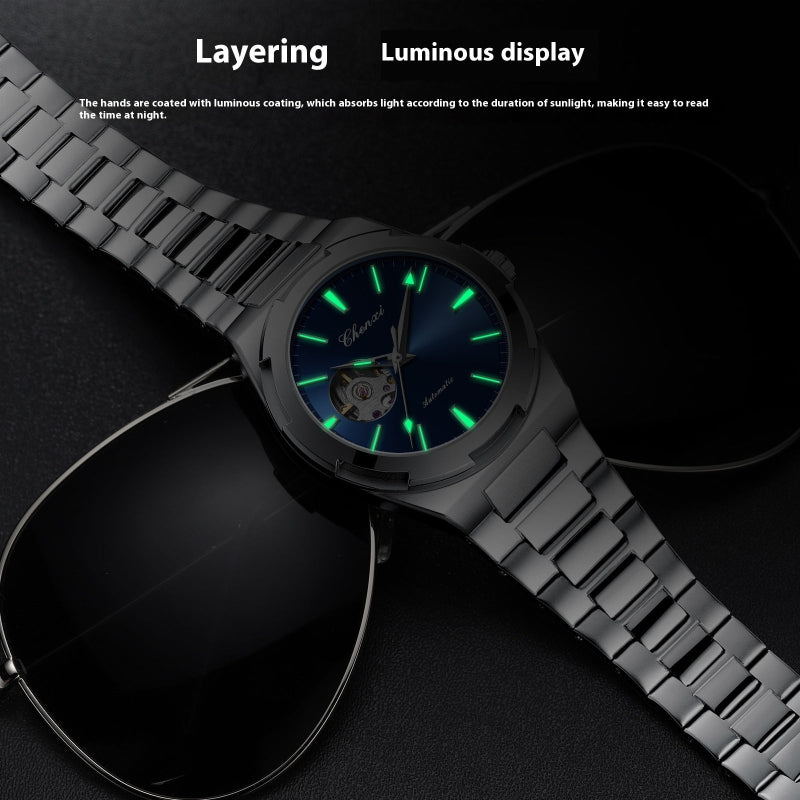 Black wristwatch with glowing green hands on a dark background