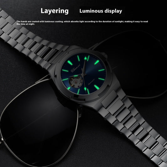 Black wristwatch with glowing green hands on a dark background
