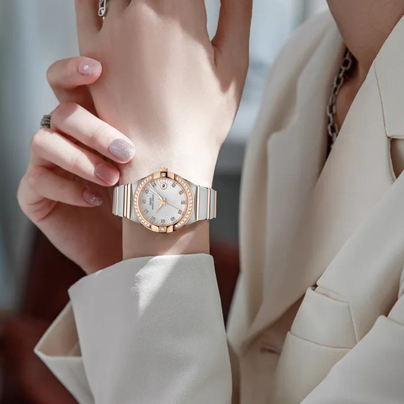 Women’s gold-tone diamond bezel quartz wrist watch with round white dial and link band