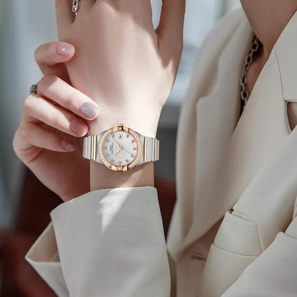 Women’s gold-tone diamond bezel quartz wrist watch with round white dial and link band