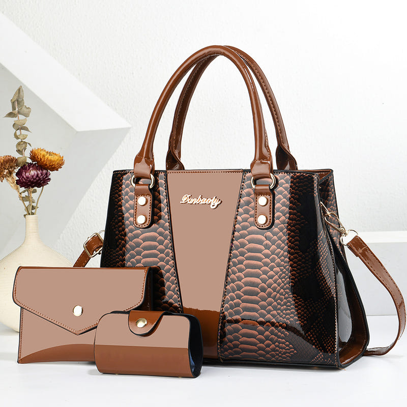 Brown and black shoulder tote bag with scalloped texture, front pocket, and wallet set
