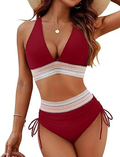 Red and white bikini set worn by a model on a white background