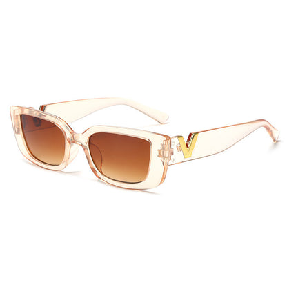 Sunglasses with a clear frame and brown lenses on a white background