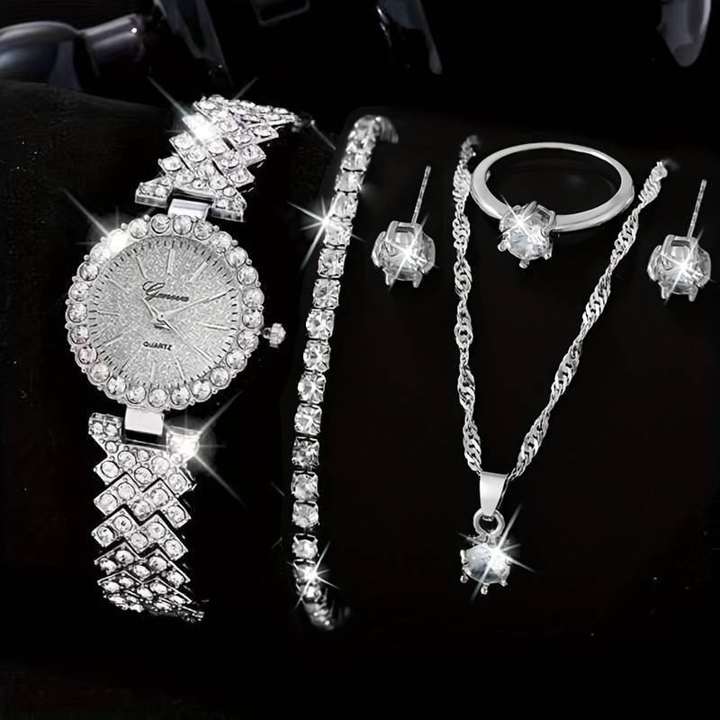 Jewelry set including a watch, bracelet, necklace, and earrings on a black background