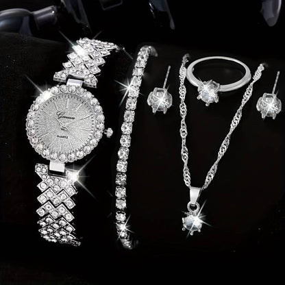 Jewelry set including a watch, bracelet, necklace, and earrings on a black background