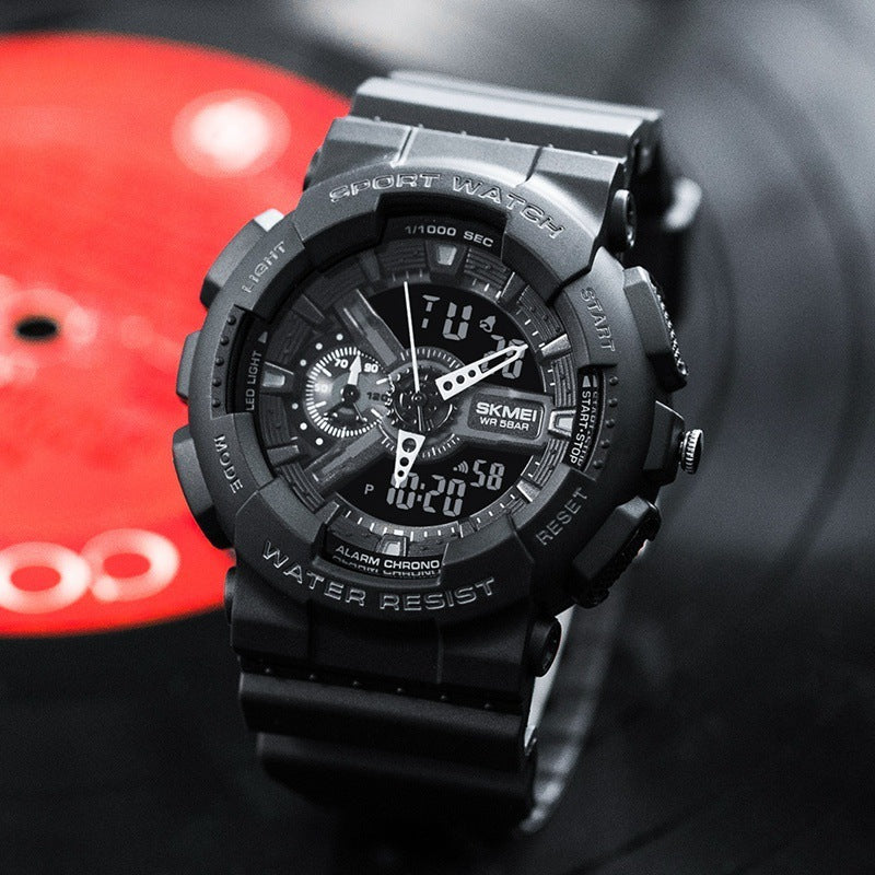 Black sports watch with digital and analog display on a blurred background