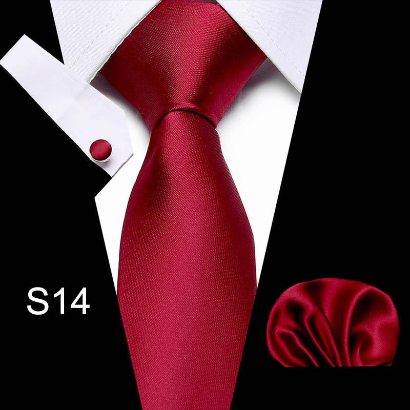 Red tie with matching pocket square on a black and white background