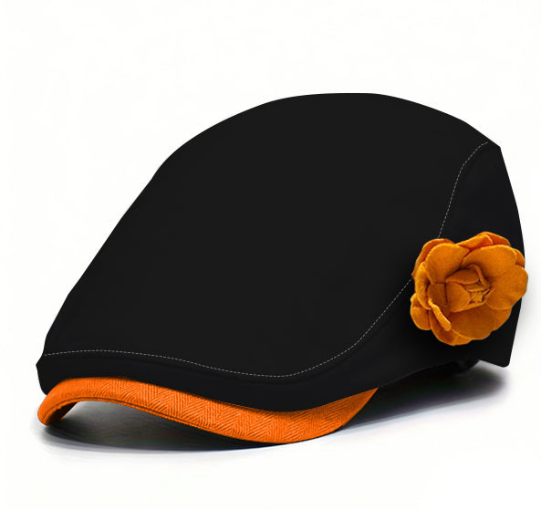 Black fabric beret with orange flower accent and orange underside brim trim.